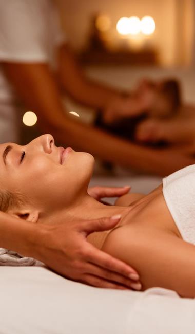 A couple is getting a massage