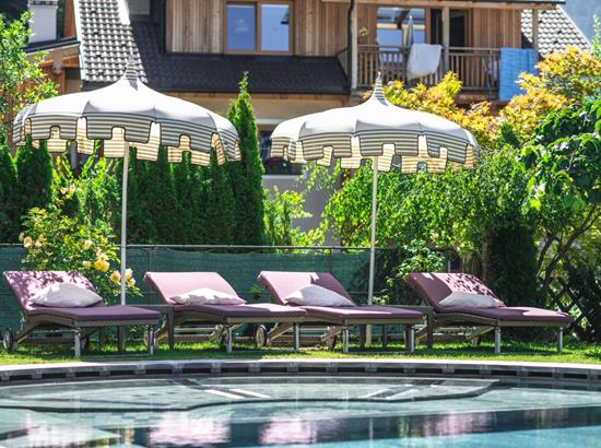 Loungers and parasols at the outdoor pool
